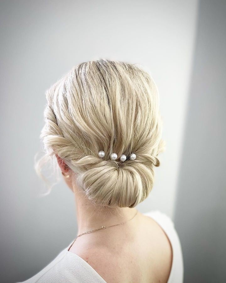 Twisted Bun With Pearl Hairpins Twisted Bun With Pearl Hairpins — Trendy Wedding Guest Updos