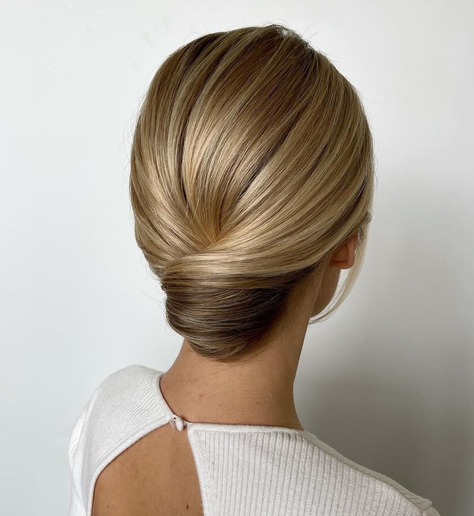 Smooth Chignon With Blonde Highlights Smooth Chignon With Blonde Highlights — Trendy Wedding Guest Updos