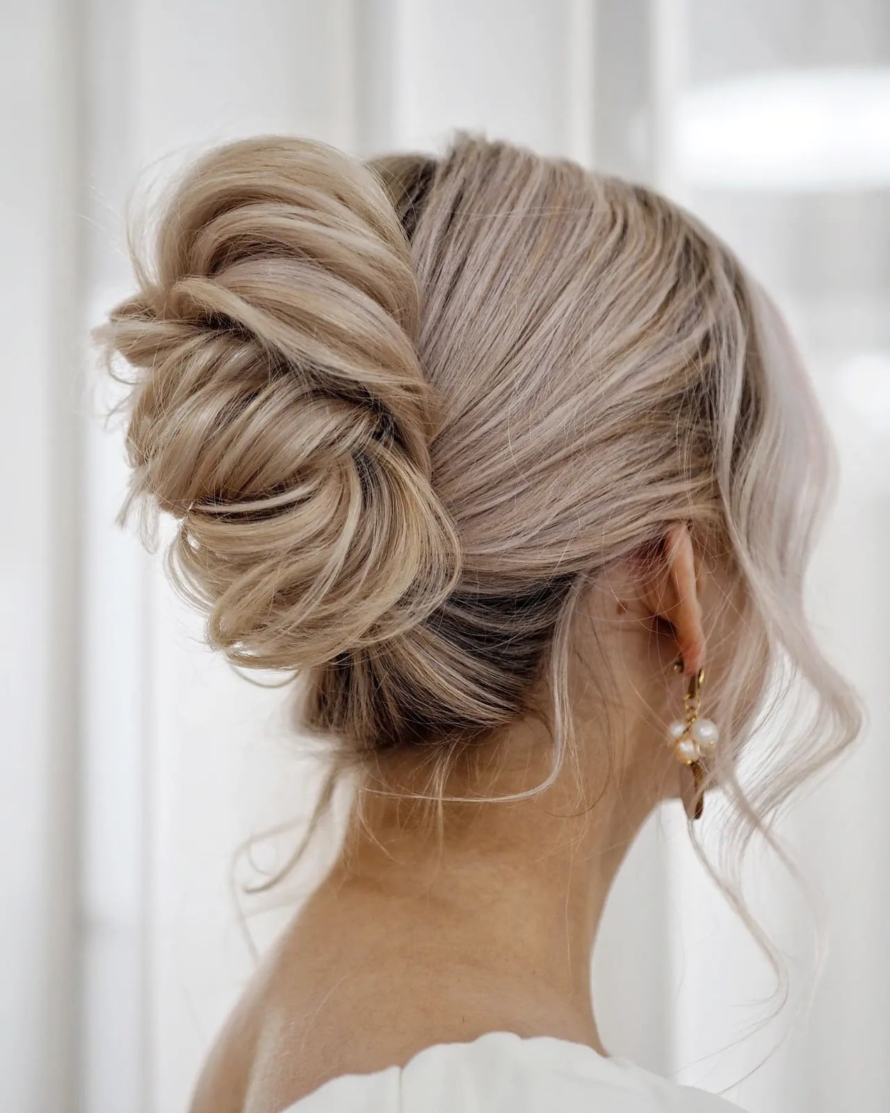 Textured Low Updo With Cool Ash Blonde Textured Low Updo With Cool Ash Blonde — Trendy Wedding Guest Updos