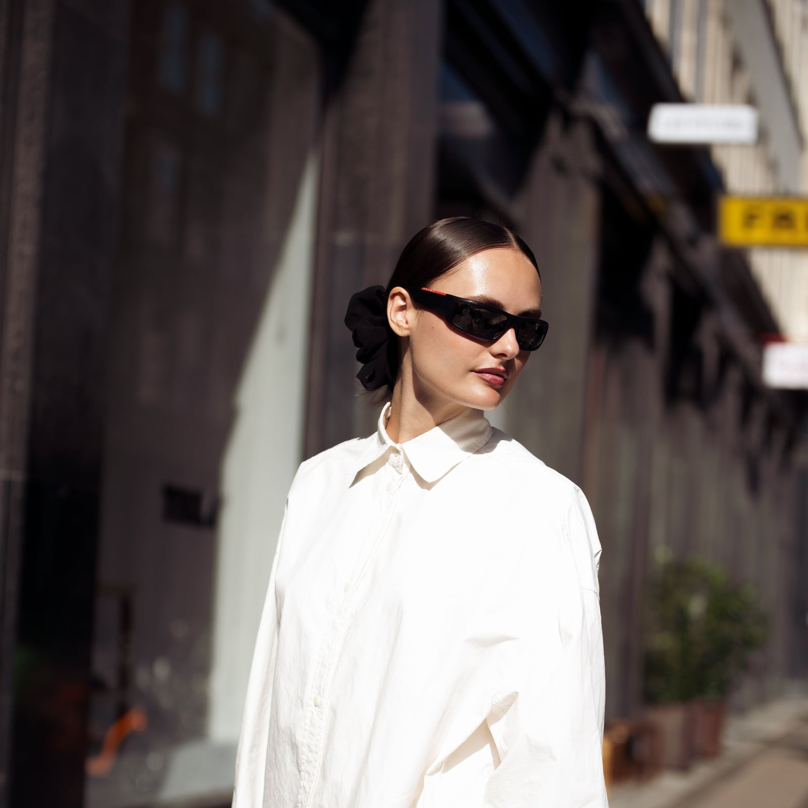 Oversized White Button Down Shirt With Black Scrunchie — Trendy White Shirt Outfits