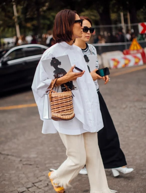 Oversized White Shirt With Wide Leg Trousers And Straw Tote — Trendy White Shirt Outfits