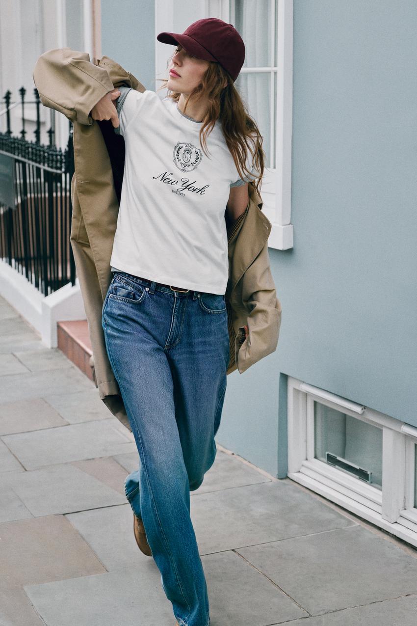 Graphic Tee Layered Over Another Tee Graphic Tee Layered Over Another Tee — Trendy White Tee Outfits