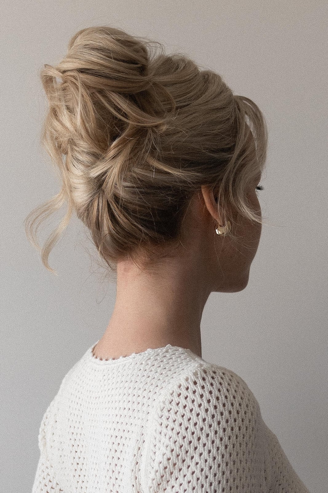 Honey Blonde High Textured Bun With Wispy Face-Framing Pieces Honey Blonde High Textured Bun With Wispy Face-Framing Pieces — Wedding Bun Ideas