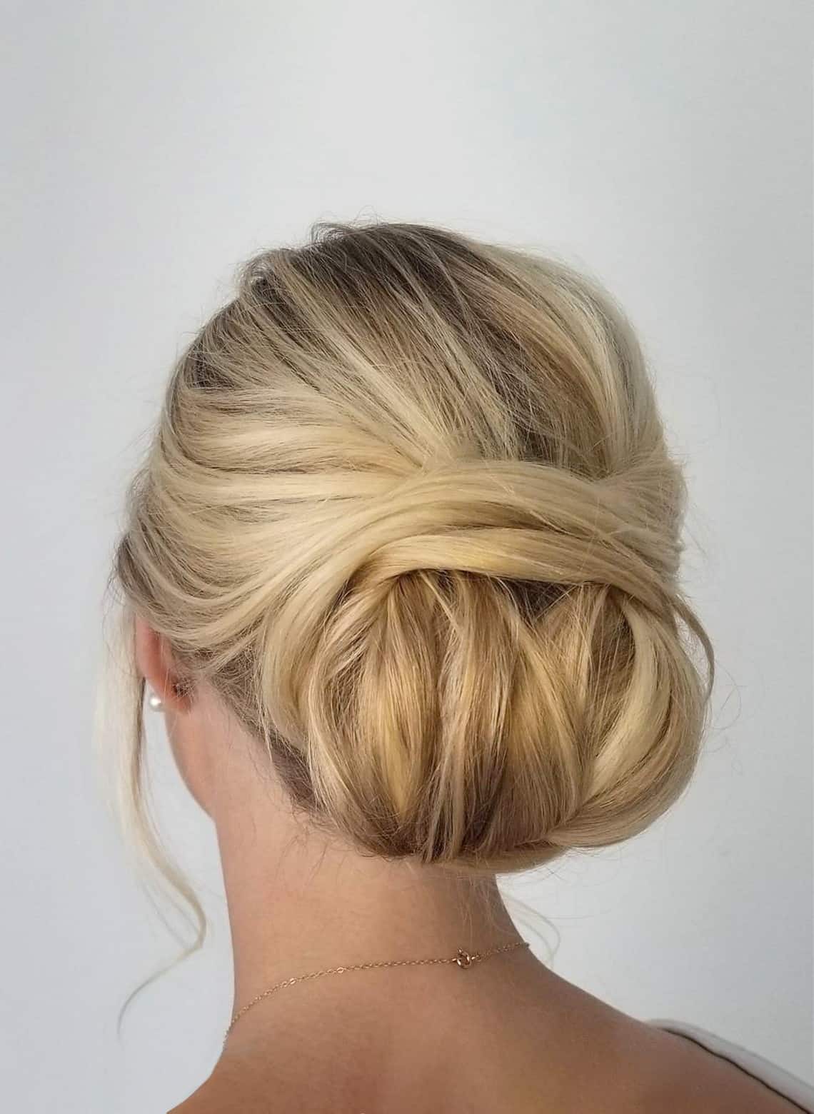 Blonde Classic Low Bun With Twisted Detail Blonde Classic Low Bun With Twisted Detail — Wedding Bun Ideas