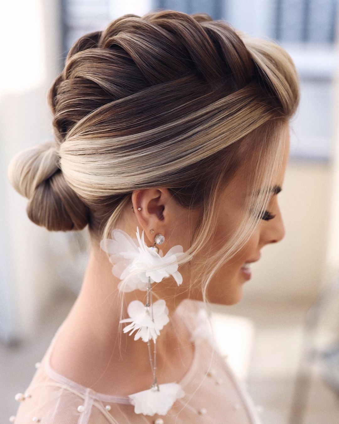 Blonde Braided Bun With Intricate Detail Blonde Braided Bun With Intricate Detail — Wedding Bun Ideas