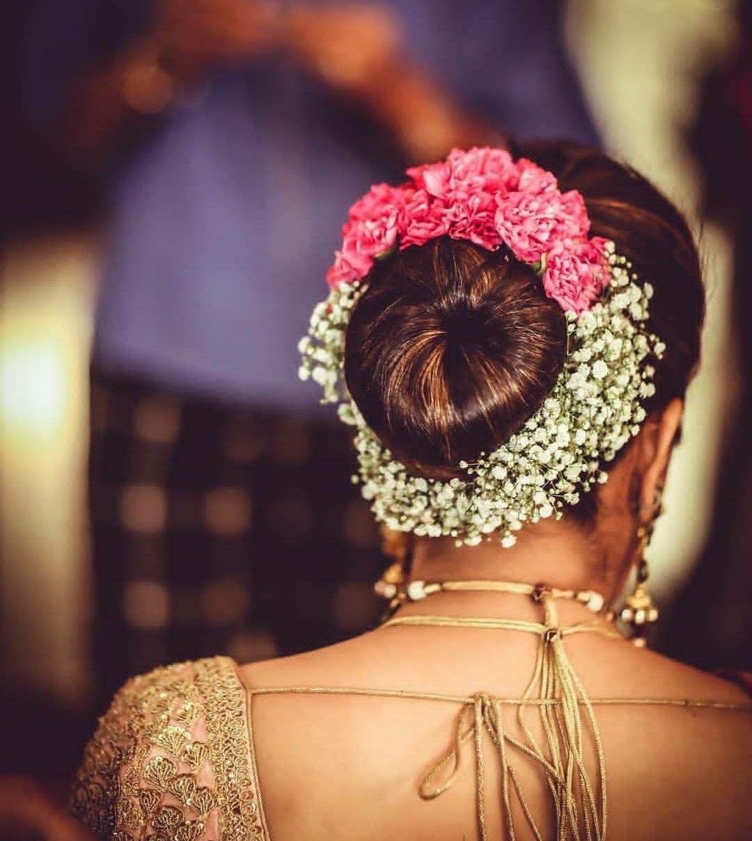 Dark Brown Voluminous Floral Bun Dark Brown Voluminous Floral Bun — Wedding Bun Ideas