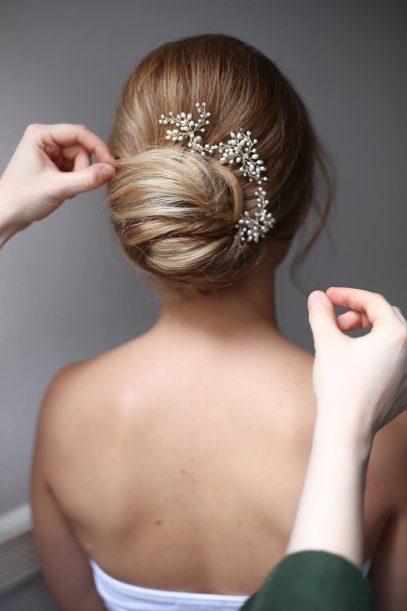 Blonde Classic Polished Bun With Pearl Accessory Blonde Classic Polished Bun With Pearl Accessory — Wedding Bun Ideas