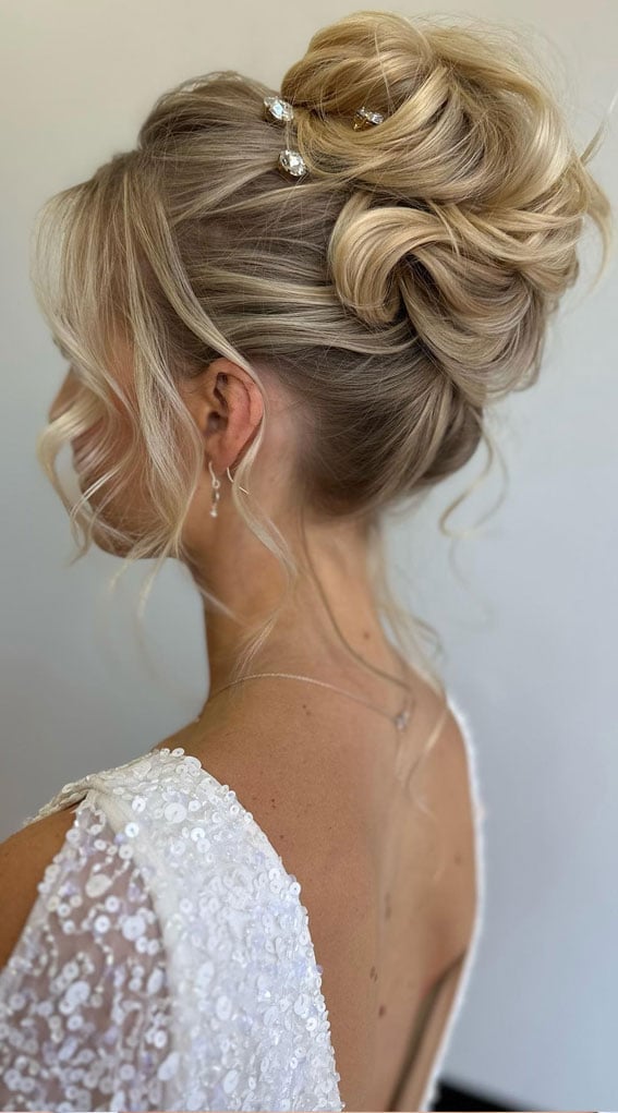 Ash Blonde Voluminous Textured Bun With Face-Framing Pieces Ash Blonde Voluminous Textured Bun With Face-Framing Pieces — Wedding Bun Ideas