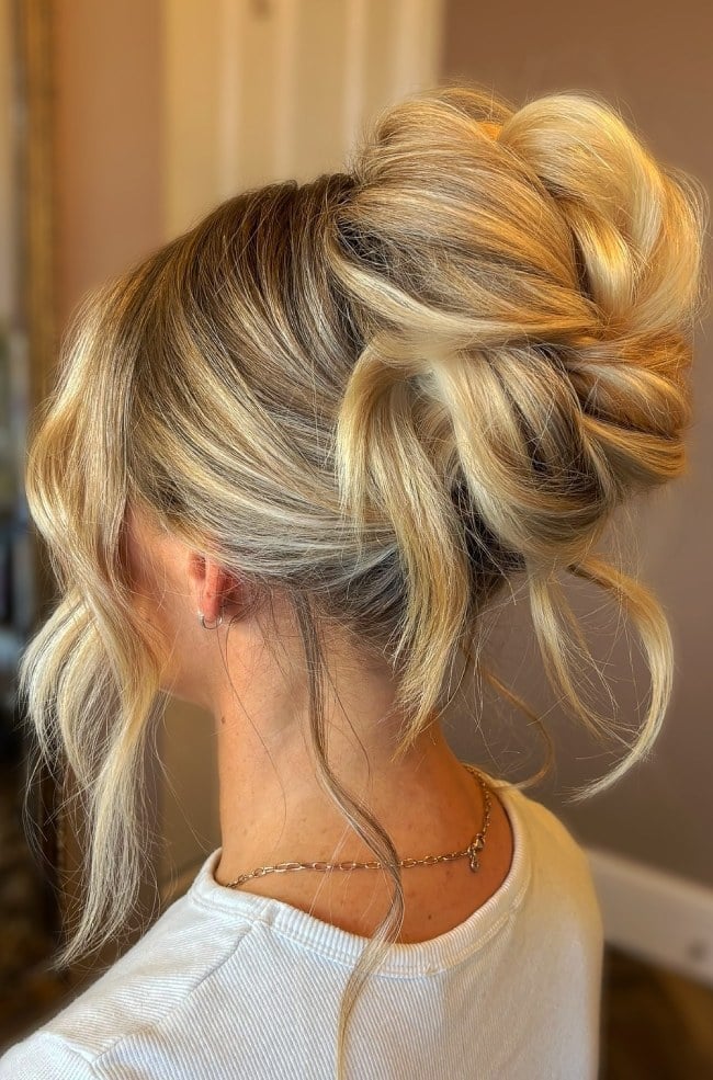Blonde Messy Textured Updo With Loose Tendrils Blonde Messy Textured Updo With Loose Tendrils — Wedding Bun Ideas