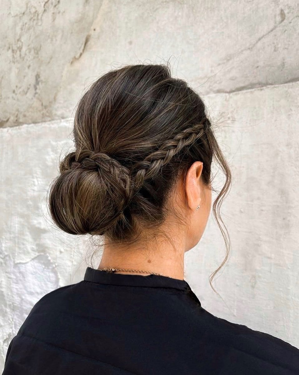 Dark Brown Intricate Braided Bun With Loose Strands Dark Brown Intricate Braided Bun With Loose Strands — Wedding Bun Ideas