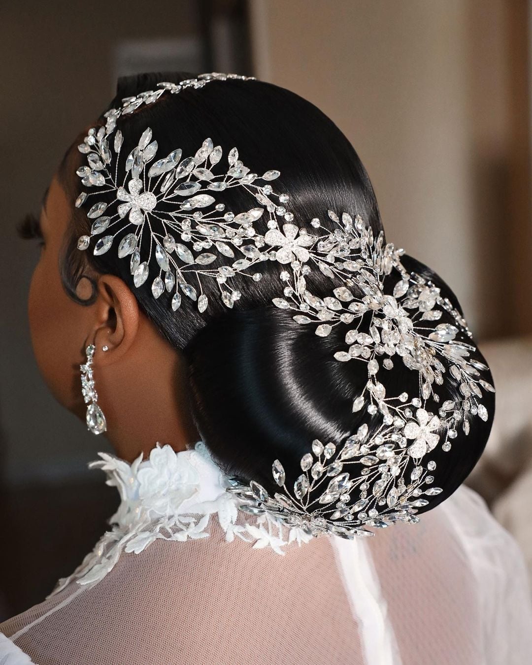 Sleek Black Sculpted Bun With Crystal Hairpiece Sleek Black Sculpted Bun With Crystal Hairpiece — Wedding Bun Ideas