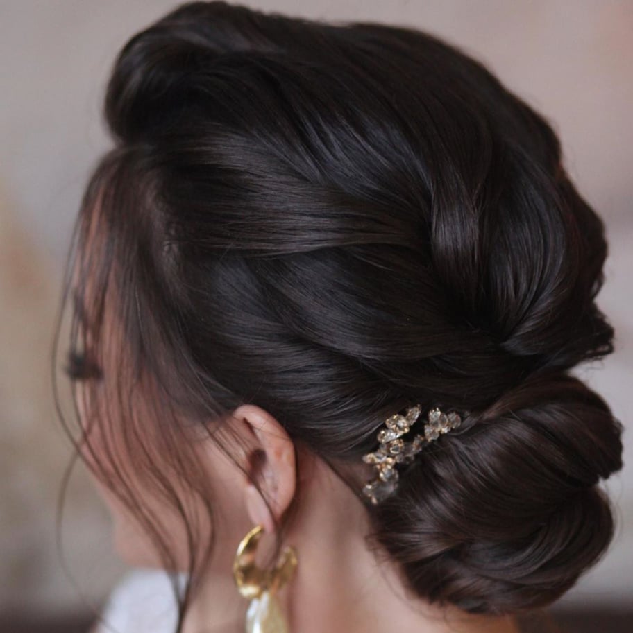 Dark Brown Sophisticated Low Bun With Sculpted Waves Dark Brown Sophisticated Low Bun With Sculpted Waves — Wedding Bun Ideas