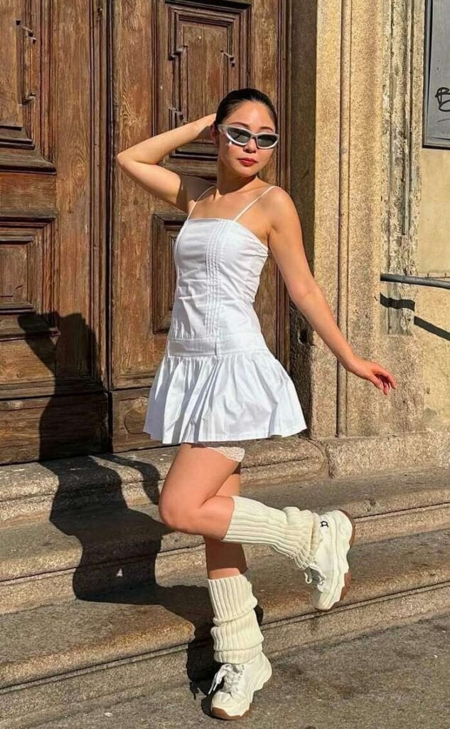 White Y2K Mini Dress with Leg Warmers and Sneakers White Y2K Mini Dress with Leg Warmers and Sneakers — Y2K Party Outfit Inspiration